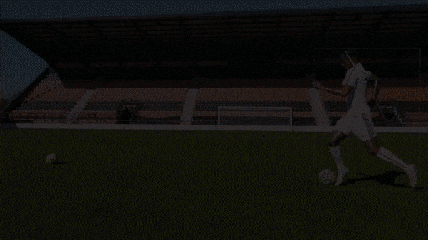 A football player performs drills on the pitch while a computer vision system tracks and grades his movements