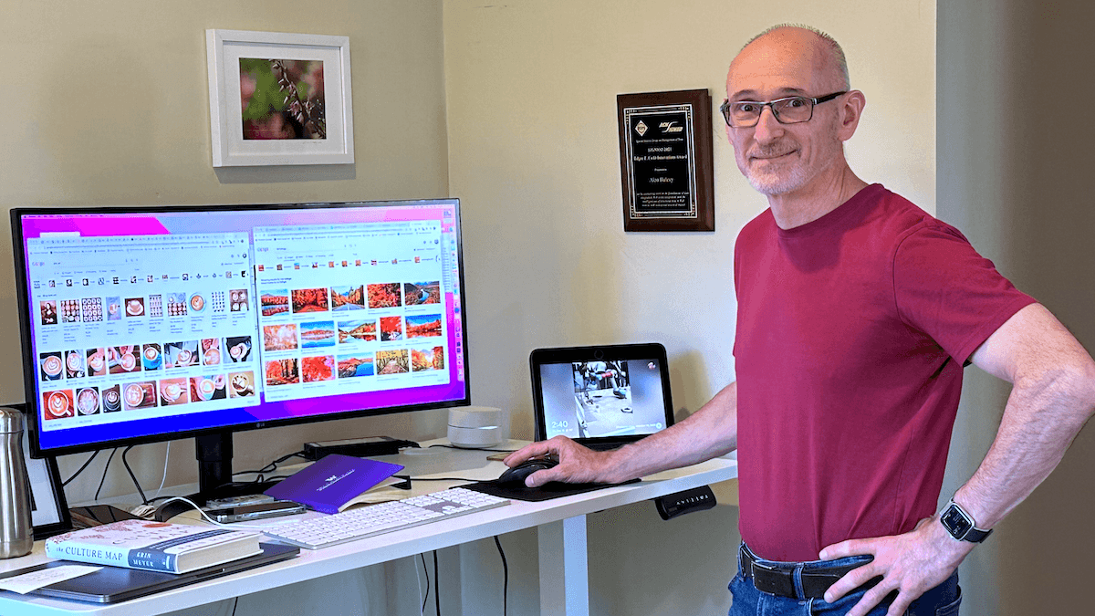 Alon Halevy next to a big computer screen